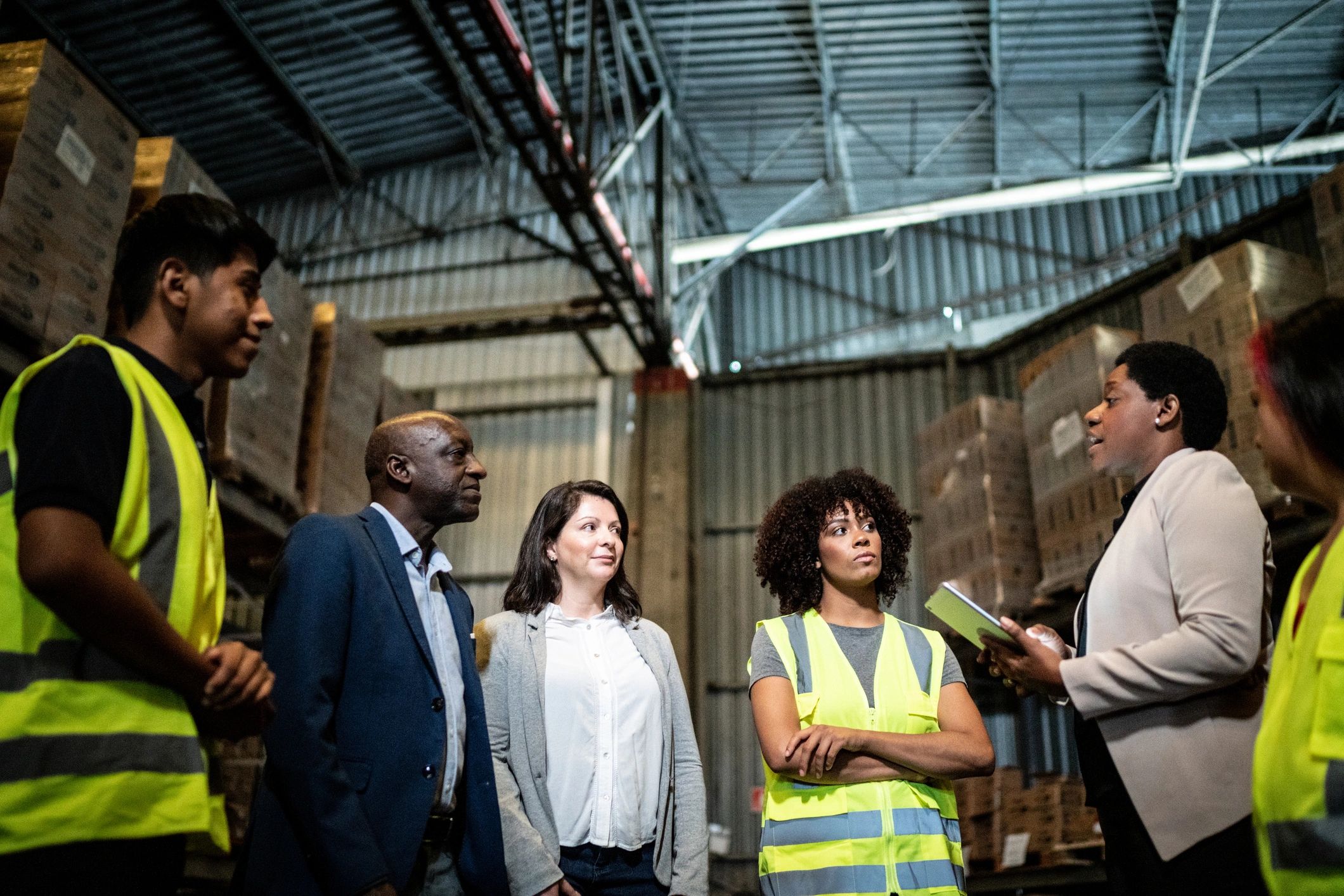 Team meeting in a warehouse setting