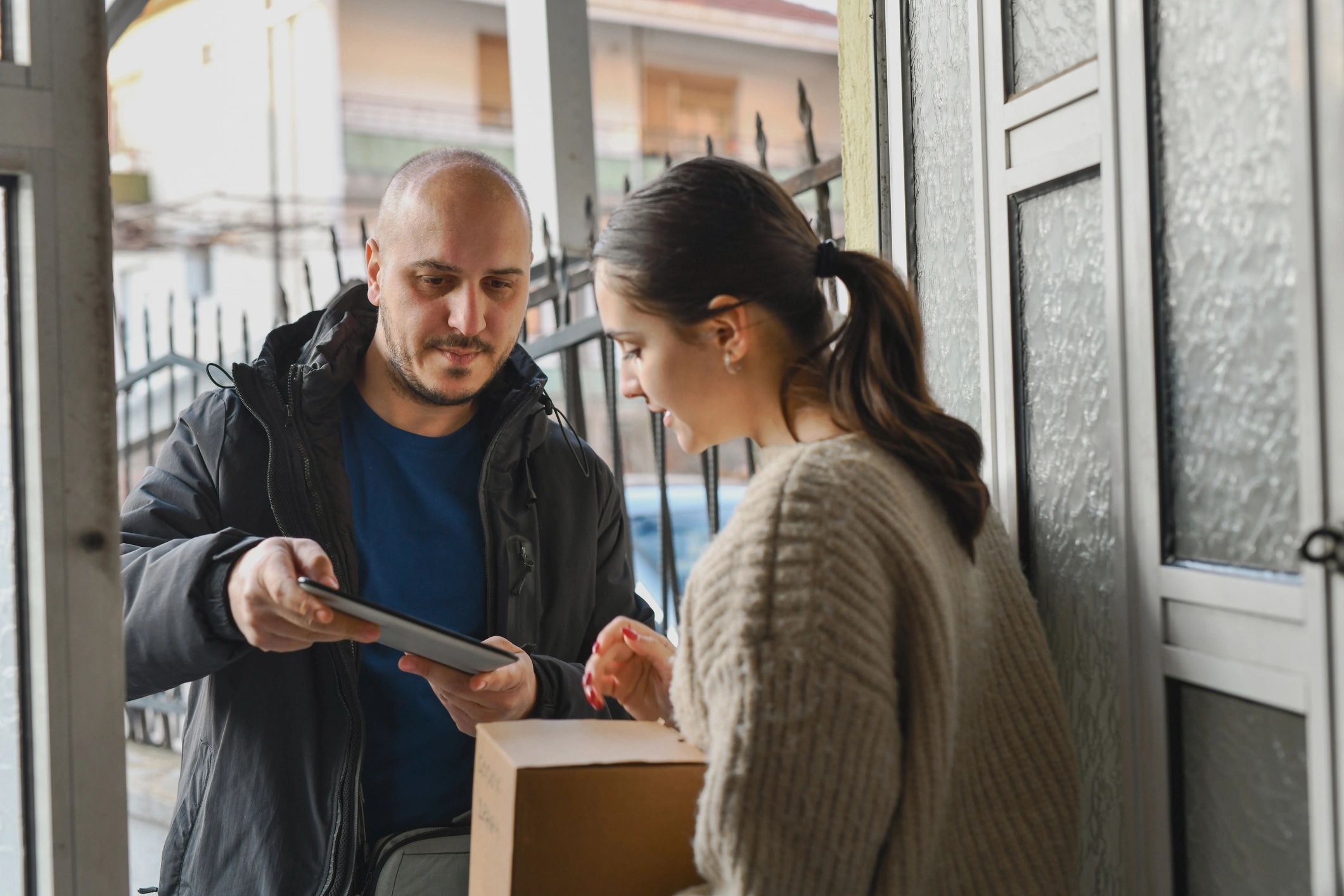 Customer receiving a package at the door